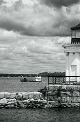 Small Barge Passes Portland Breakwater Light -BW